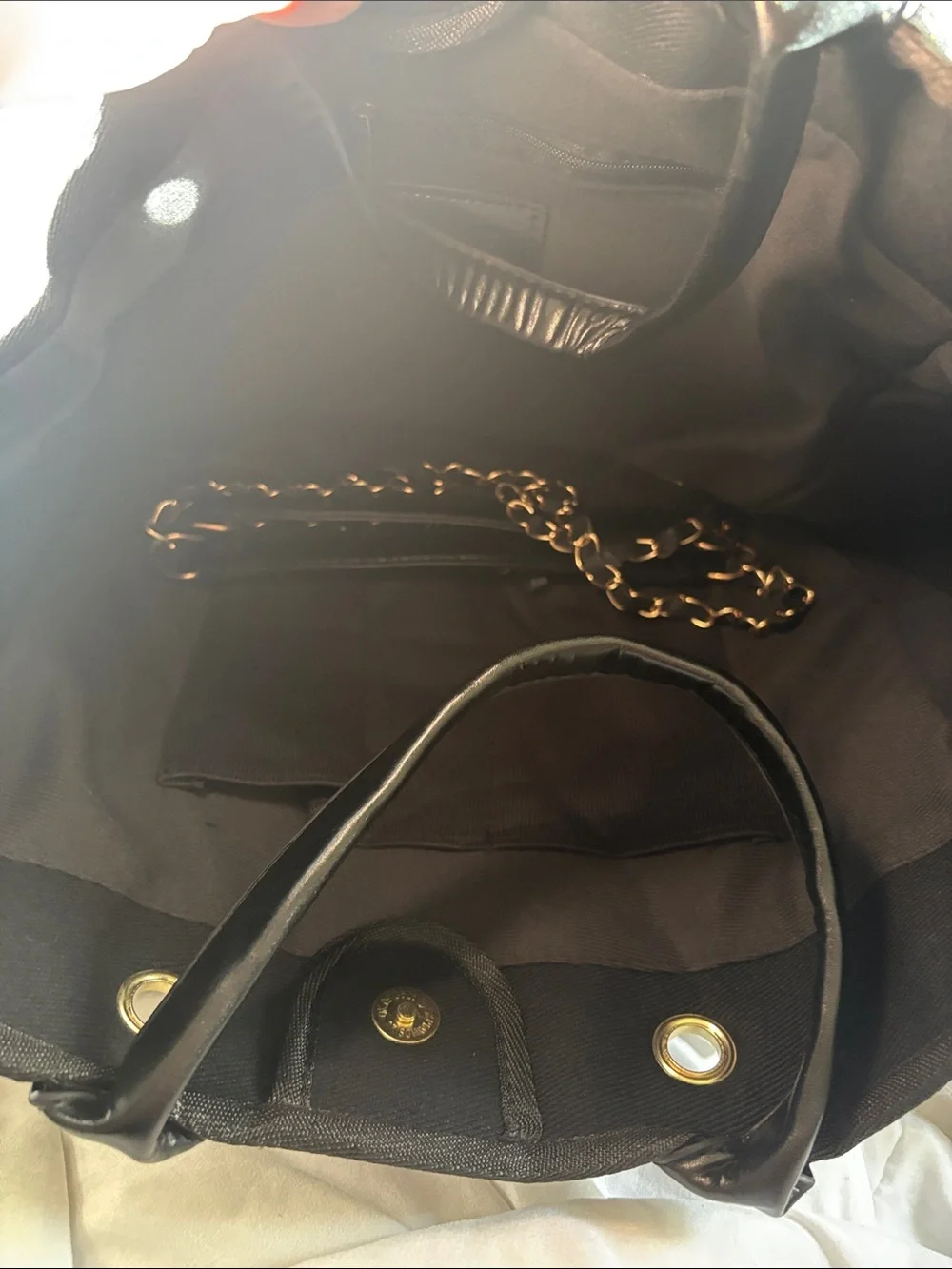 Chic Black Studded Tote with Chain Handles and Gold Accents